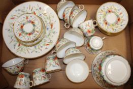 An antique hand painted tea service and part coffee set, decorated with floral design, to include