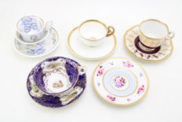 A group of Worcester cups and saucers, comprising Worcester Flight Barr and Barr cup and saucer,