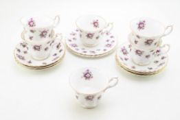 Royal Albert 'Sweet Violets' patter tea ware comprising six cups and saucers, together with two side