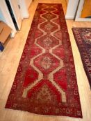 Vintage hand-knotted Turkish Oushak wool runner rug with a geometric pattern.