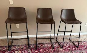 Set of 3 Signature Design by Ashley Centiar brown faux leather bar stools with a black metal base