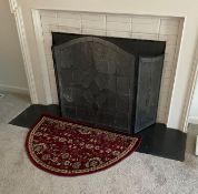 Glass Fireplace Screen with Rug and Metal Quilt Rack