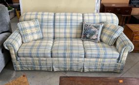 Plaid Skirted Sofa with Rolled Arms and Accent Pillows