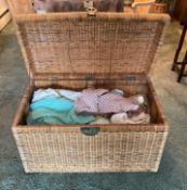 Crocheted Blankets and Baby Clothes in a Large Woven Rattan Chest
