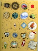 A CARD OF DIVISION THREE CERAMIC BUTTONS