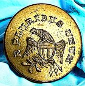 A SCARCE USAGE/UNIFORM BRASS BUTTON