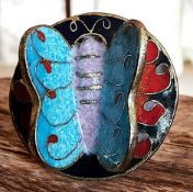 A DIVISION THREE ENAMEL ANIMAL BUTTON