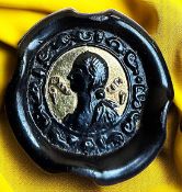 A DIVISION THREE BLACK GLASS PICTORIAL BUTTON