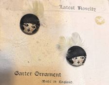 A SMALL CARD OF DIVISION THREE FABRIC BUTTONS