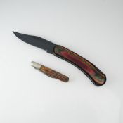 Two Folding Pocket Knives Including Fury 10074 and Queen City Cutlery