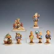 A Collection of 7 Goebel M.J. Hummel Ceramic Figurines