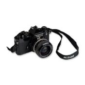 Nikon FE Black 35mm SLR Camera with 24mm Nikkor Lens and Case