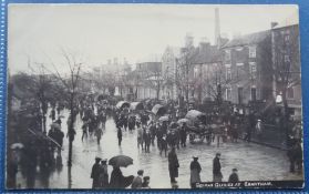 Postcards, a scarce RP card of German Gypsies passing through Grantham Lincs on a wet day (gd)