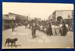 Postcard, Charlie Chaplain, walking down a street in Mexico (fair/gd)