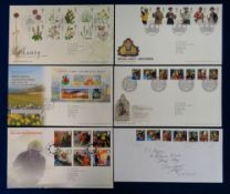 Stamps, GB QEII collection of first day covers housed in 26 blue folders, most of which have a