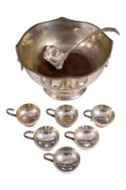 A silver plated punch bowl - with a shaped gadrooned rim, a pair of lion mask ring handles and