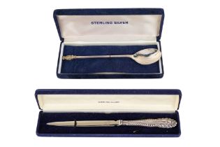 A silver spoon - Sheffield 2000, with a planished bowl and gilt knop in the form of a pineapple,