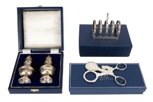 A silver five bar toast rack - Sheffield 2002, of simple arched pattern, together with a pair of
