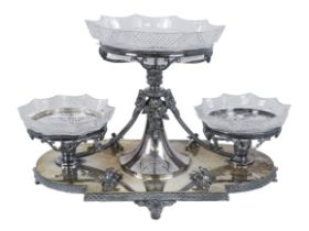 A late Victorian silver plated table centre - with three clear pressed glass bowls on a foliate