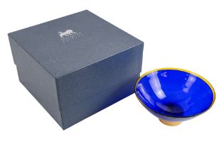 A gilt silver mounted blue glass bowl - London 2003, of dished form with an amber rim and gilt