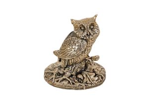 A silver model of an owl - Sheffiled 1995, perched on a branch and raised on a wooded oval base, 6cm