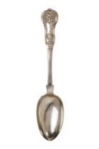 A white metal table spoon - with a fiddle shaped back, cast in low relief with foliage, 82g.