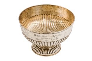 A silver rose bowl - London 1908, part gadrooned and raised on a circular foot, 531g.