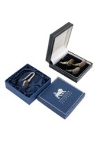 Three silver menu holders - modelled as pheasants, boxed, together with a napkin hook, also boxed,
