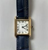 CARTIER. MontreTank. Montre bracelet pour femme en plaqué or « Electroplated l 18K », boîtier rectan