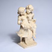 Alabaster sculpture of a romantic scene with two children