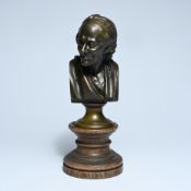 Bronze bust of Voltaire on a turned wooden base, circa 1900
