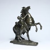 Bronze sculpture of a charioteer, modeled after 'Les chevals de Marly' by Guillaume Coustou
