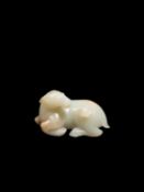 A WHITE JADE AND RUSSETT CARVING, China, Qing dynasty, 18th century