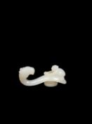 A WHITE JADE BELT HOOK, China, Qing dynasty, 18th/19th century