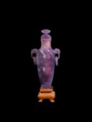 AN AMETHYST BALUSTER-SHAPED VASE AND COVER, China, early 20th century