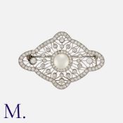 A Fine Pearl and Diamond Brooch in platinum, of openwork form, set with a principal round pearl