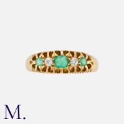 An Antique Emerald and Diamond Ring in 18K yellow gold, set with three emeralds and two old cut