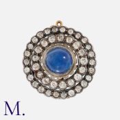 An Antique Sapphire and Diamond Brooch in yellow gold and silver, set with a central cabochon blue