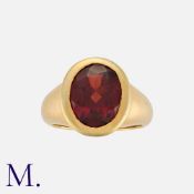 A Garnet Ring in 18 carat yellow gold, set with an oval cut garnet of approximately 3.40 carats.