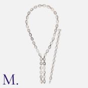 CARTIER. A Diamond Diadea Necklace and Bracelet Set in 18K white gold, set with round cut