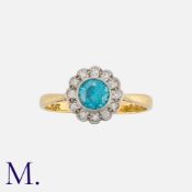 A Zircon and Diamond Cluster Ring in 18 carat gold and platinum, set with a principal round cut