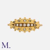 An Antique Pearl and Diamond Brooch in yellow gold, the navette form set with old cut diamonds and