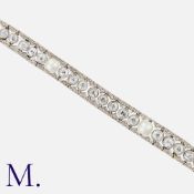 An Antique Natural Saltwater Pearl and Diamond Bracelet in white gold, of openwork design,