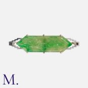 A Jade and Diamond Brooch in 9 carat gold, comprising an elongated carved hexagonal jade plaque, set