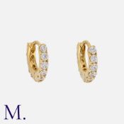 A Pair of Diamond Hoop Earrings in 18 carat yellow gold, of hoop design, set with round cut diamonds