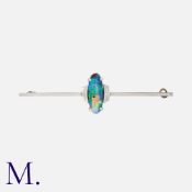 An Opal Brooch in 9 carat white gold, set with a cabochon opal measuring approximately 14 x 5mm,