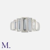 An Unusual Diamond Five Stone Ring in platinum, set with five elongated baguette cut diamonds, all