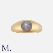 A Star Sapphire Ring in 18 carat yellow gold, set with a cabochon star sapphire of approximately 1.