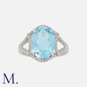 An Aquamarine and Diamond Ring in white gold, set with an oval-cut aquamarine weighing 5.07ct with