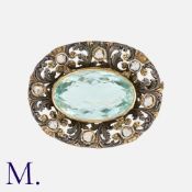 An Antique Aquamarine Brooch in silver and gold set with a large aquamarine to the centre and rose